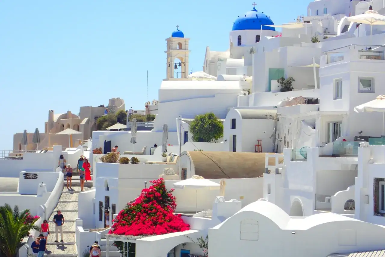 Explore Santorini, Greece! Wander through whitewashed villages, admire blue-domed churches, and enjoy stunning caldera views. Perfect for a romantic getaway or a family adventure.
