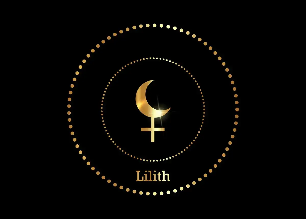 S&iacute;mbolo dorado de Lilith en astrolog&iacute;a, rodeado de c&iacute;rculos de puntos dorados sobre fondo negro.