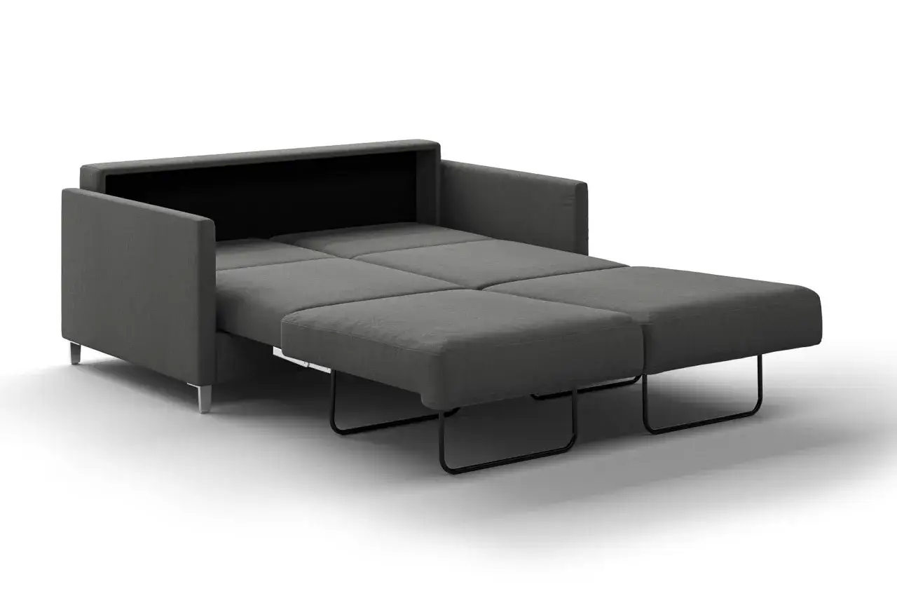A grey pull-out sofa is shown partially unfolded, revealing its mattress sections and metal frame.