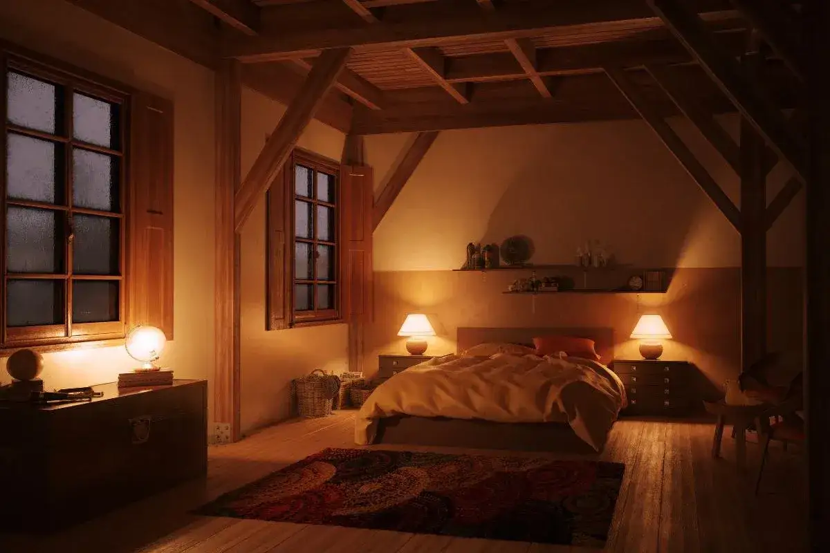 Gemütliches Schlafzimmer mit warmem Licht, das die Angst vorm Schlafen vertreiben soll. Ein Bett, zwei Nachttische mit Lampen und ein Teppich.