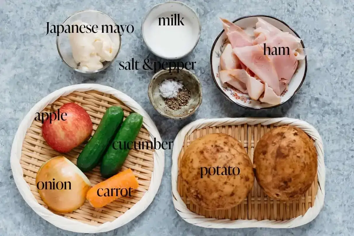 Ingredients for Japanese potato salad: potatoes, ham, apple, cucumber, carrot, onion, Japanese mayo, milk, salt & pepper.