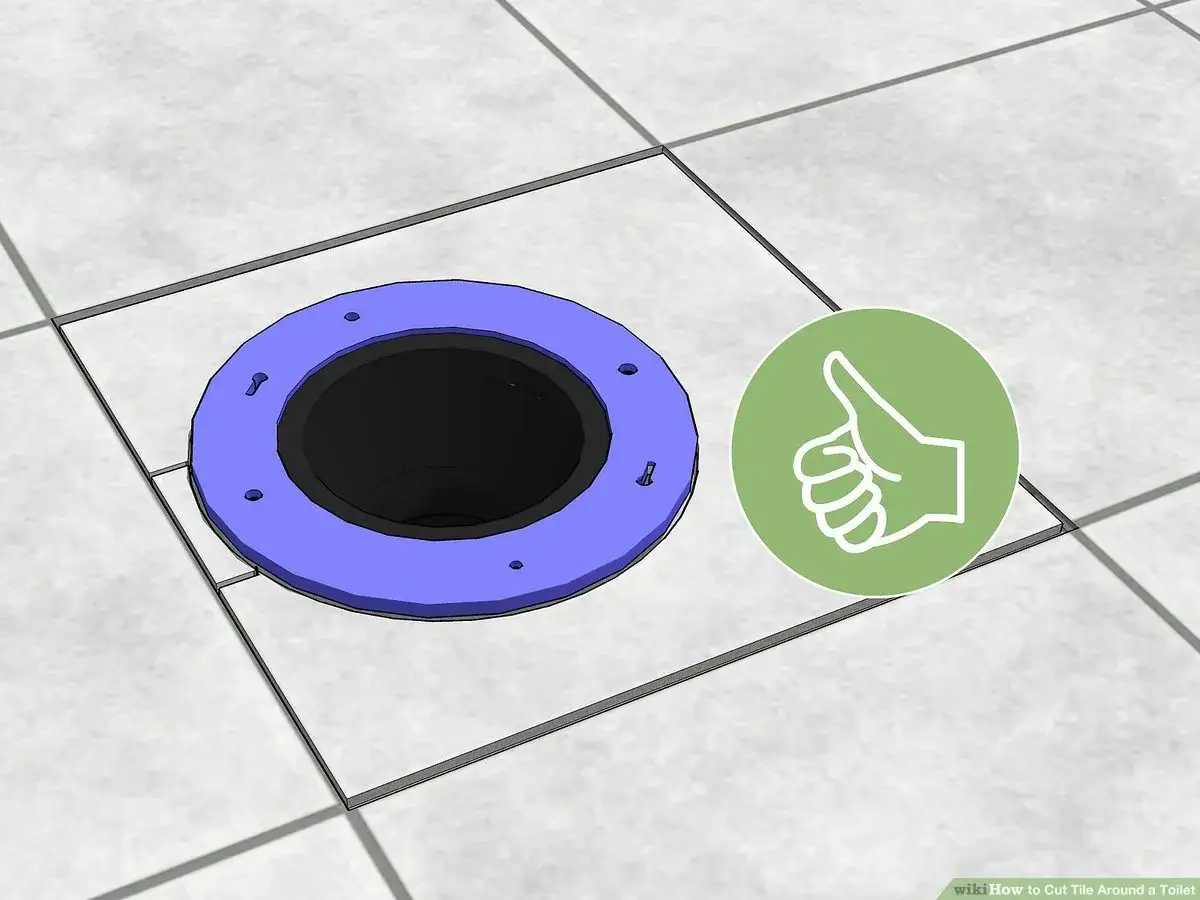 A toilet flange sits on tiled floor, showing how to cut tile around toilet. A green circle with a thumbs-up icon is nearby.