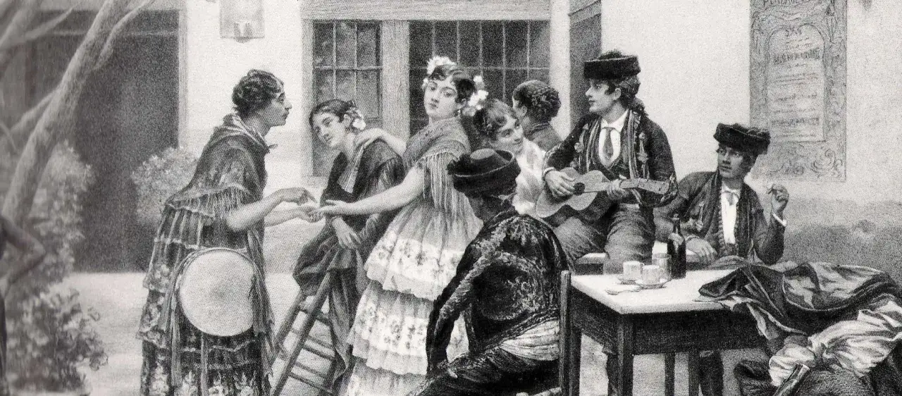 Una escena de flamenco con m&uacute;sicos y bailarines. Un hombre toca la guitarra, otro golpea un tambor. &iquest;Qui&eacute;n creo el flamenco? Quiz&aacute;s ellos.