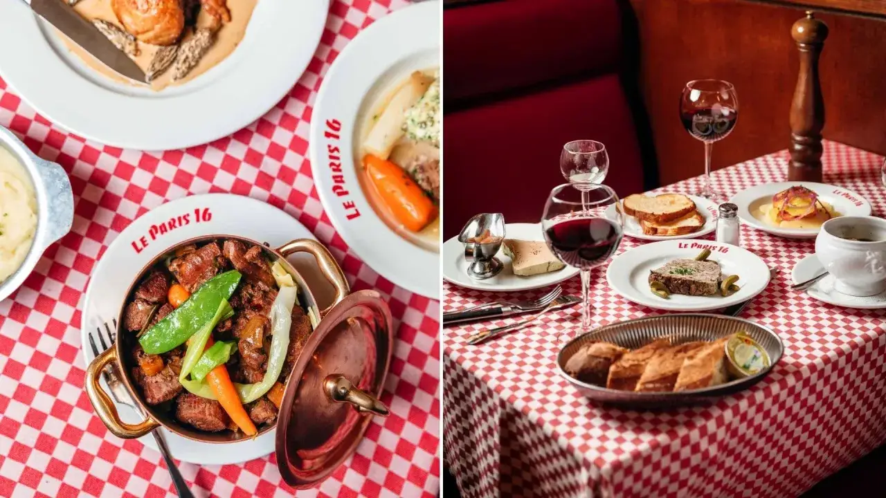 Un plat typique de Paris : un bœuf bourguignon mijoté dans une cocotte en cuivre, servi avec des légumes croquants. Une table dressée avec d'autres délices parisiens.