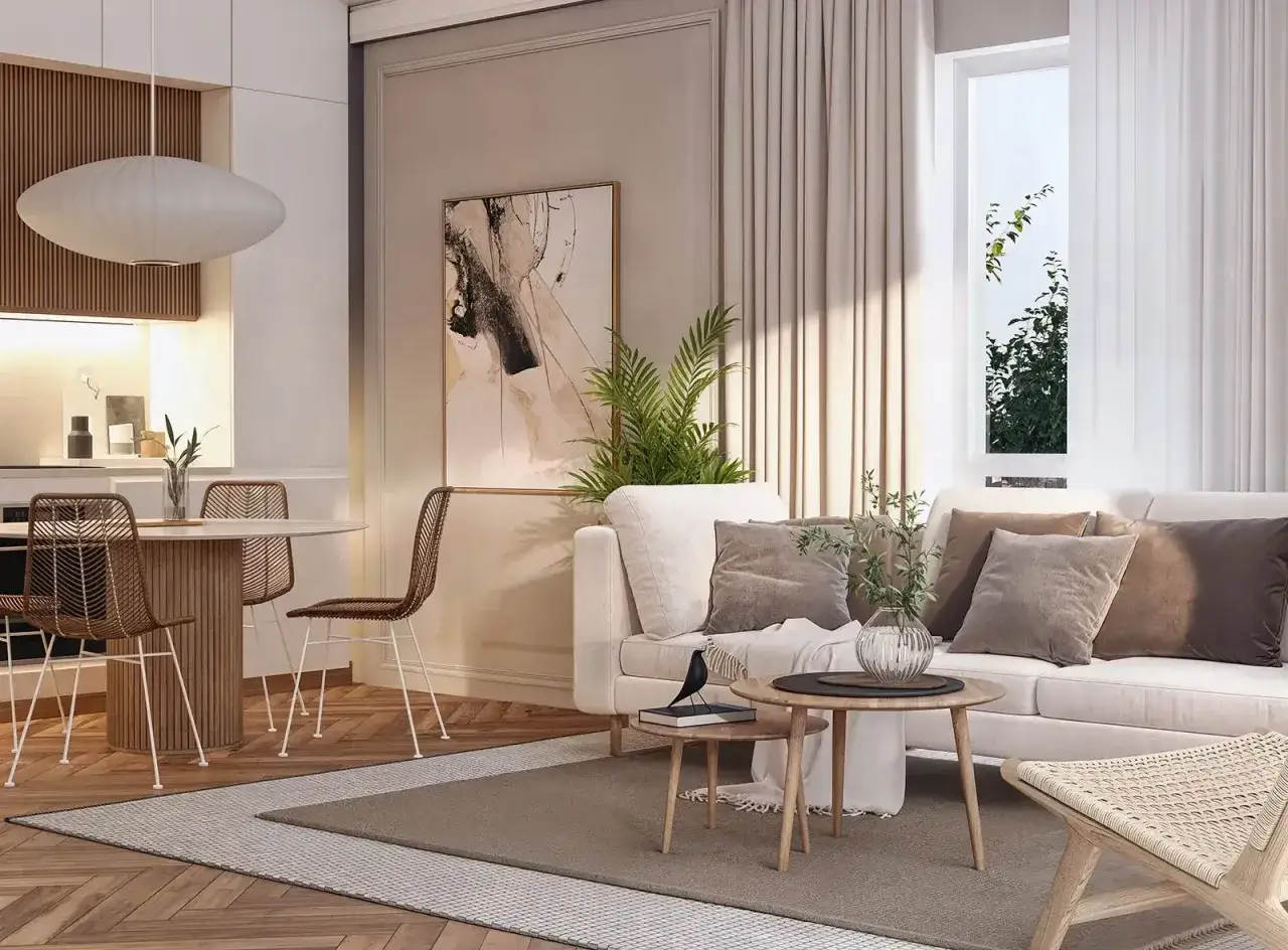 Przytulny salon w kolorze neutralnym. Jasna kanapa, stoliki kawowe, dywan i dekoracje tworzą spokojną atmosferę.