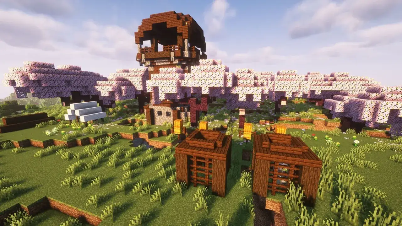 Wiosenna kraina w Minecraft z kwitnącymi drzewami wiśni, wieżą i małymi chatkami. Idealne miejsce na rozpoczęcie przygody, odkryj najlepsze seedy w Minecraft!