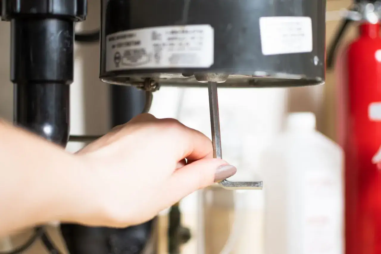 Using an Allen wrench to manually turn the garbage disposal's motor shaft is a key step in how to unclog garbage disposal.