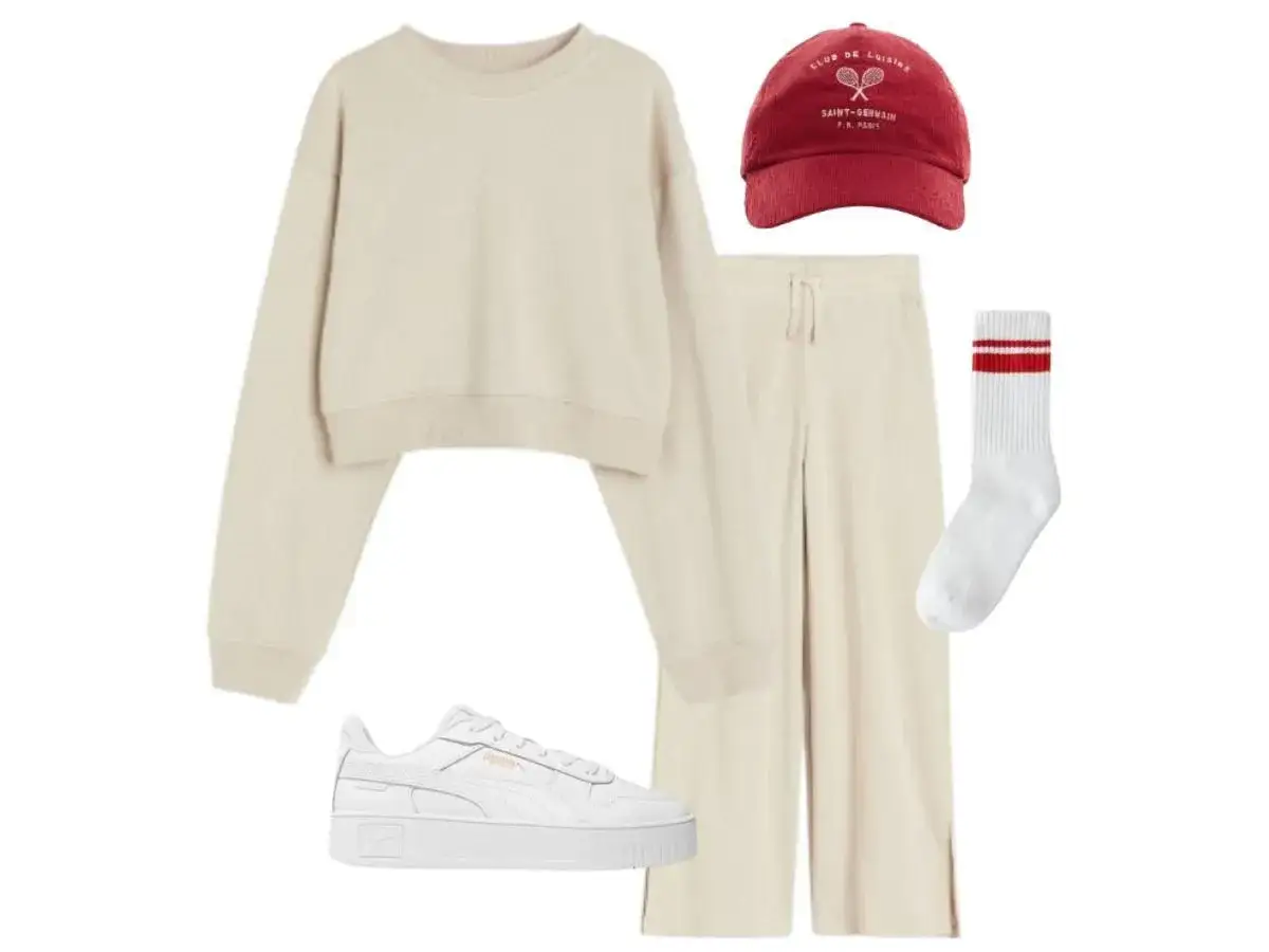 Kremowy komplet dresowy, białe sneakersy, czerwona czapka i białe skarpetki z czerwonymi paskami – idealny outfit do szkoły.