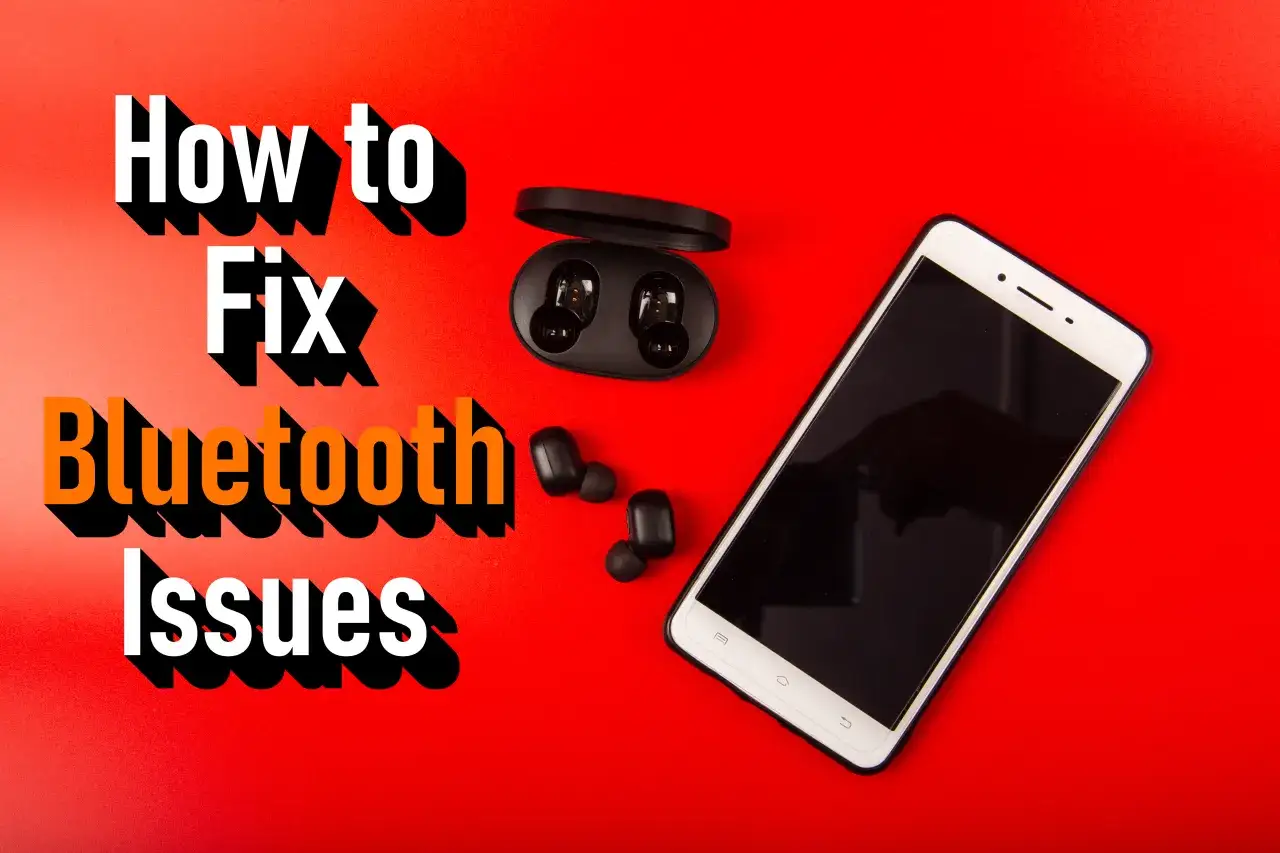 Jak naprawić problemy z Bluetooth na iPhone? Na czerwonym tle leży smartfon, słuchawki bezprzewodowe i ich etui.