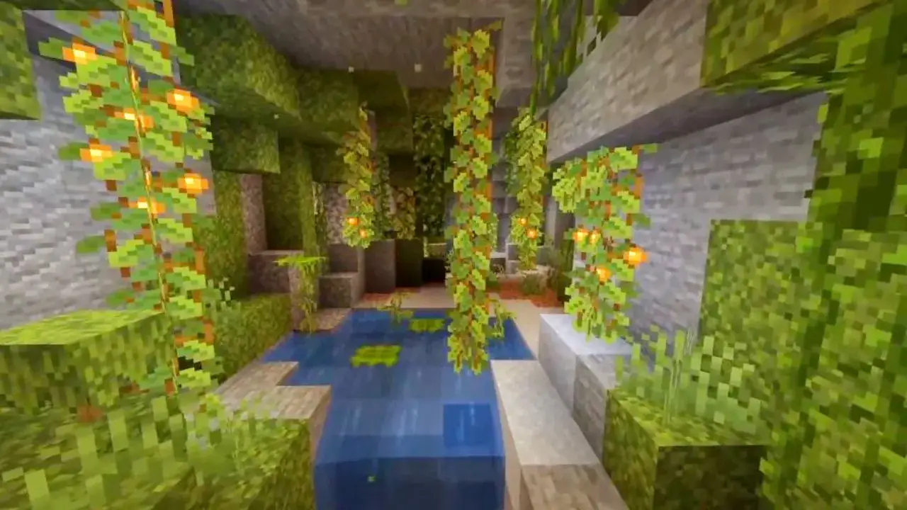 Podwodny ogród w jaskini Minecraft, porośnięty blokiem mchu, z wiszącymi pnączami i latarenkami.