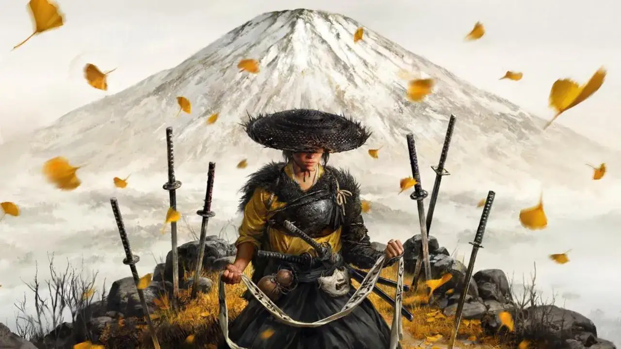 Samuraj w słomkowym kapeluszu, otoczony mieczami i opadającymi liśćmi, na tle g&oacute;ry. Zapowiedź Ghost of Tsushima 2.