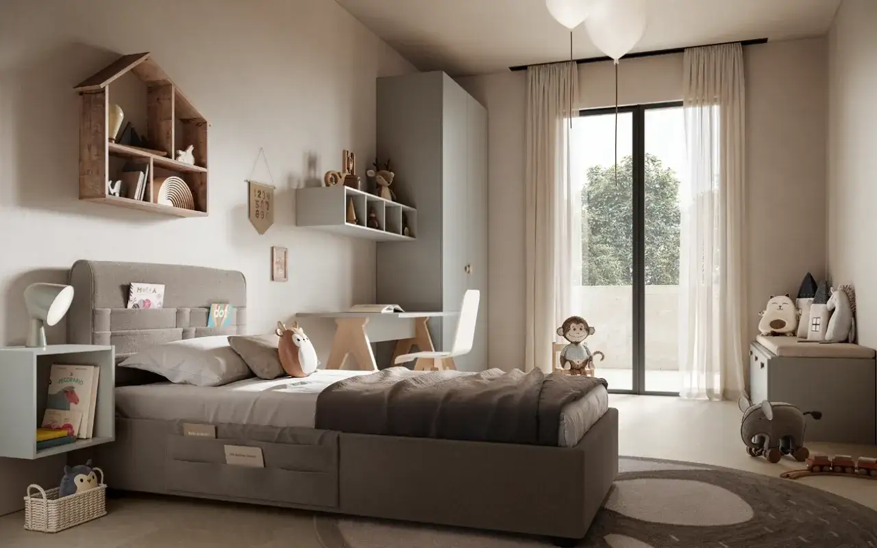 Accogliente zona studio ragazzi con letto, scrivania e armadio. Peluche e decorazioni a tema animale rendono lo spazio giocoso.