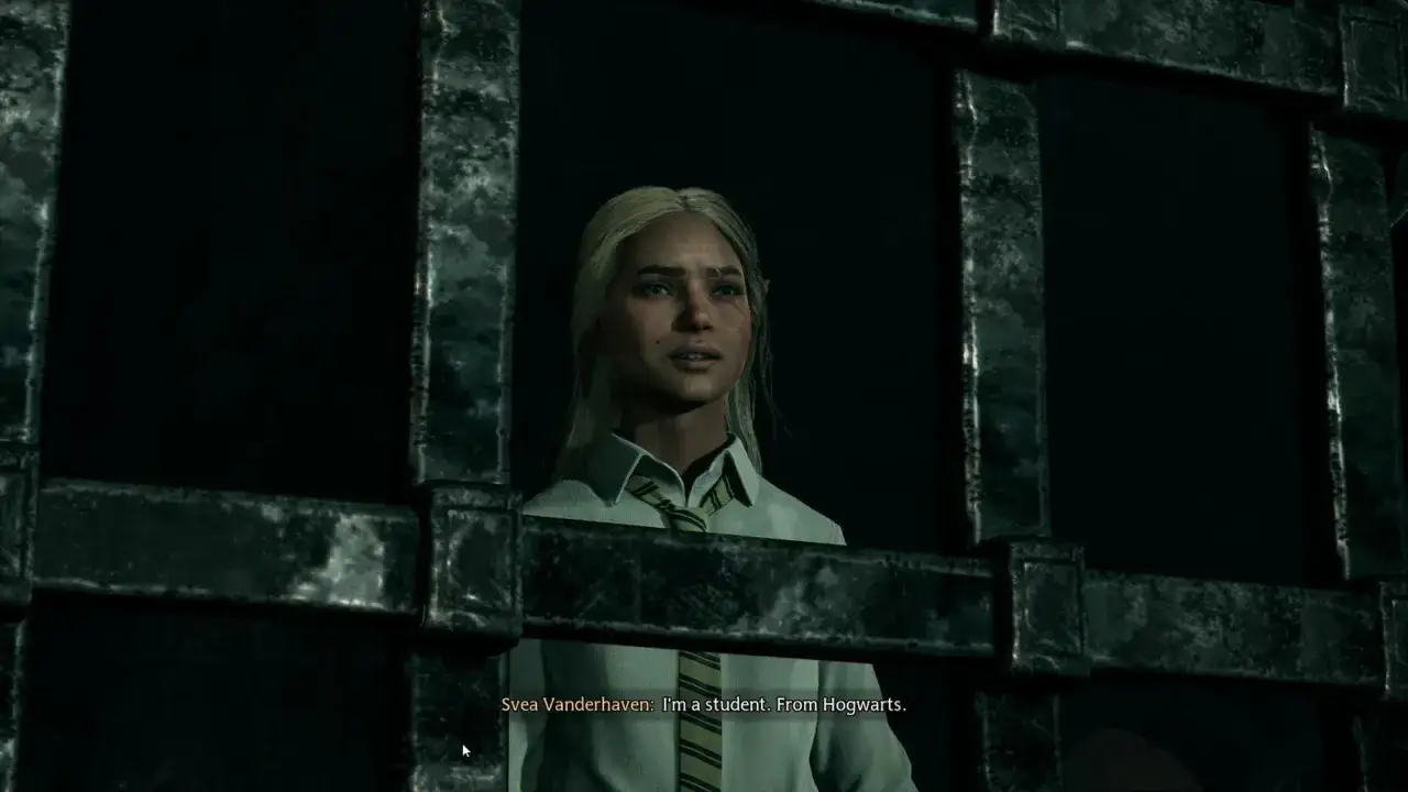 Hogwarts Legacy: Eine junge Hexe mit blonden Haaren blickt hoffnungsvoll durch Gitterst&auml;be, als ob sie aus Askaban entkommen will.