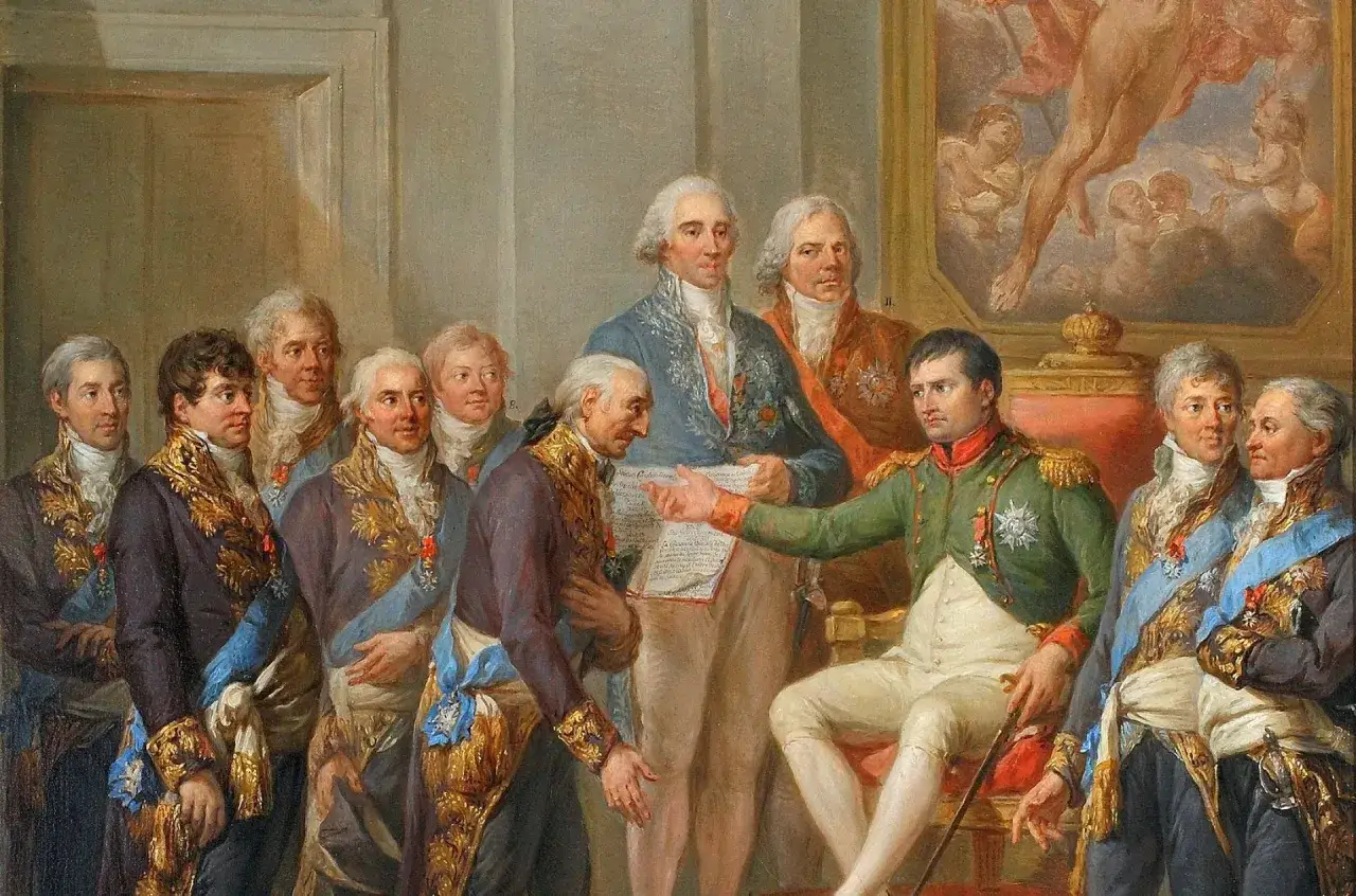 Napoleon Bonaparte wręcza dokument, który jest Konstytucją Księstwa Warszawskiego, grupie dostojników.