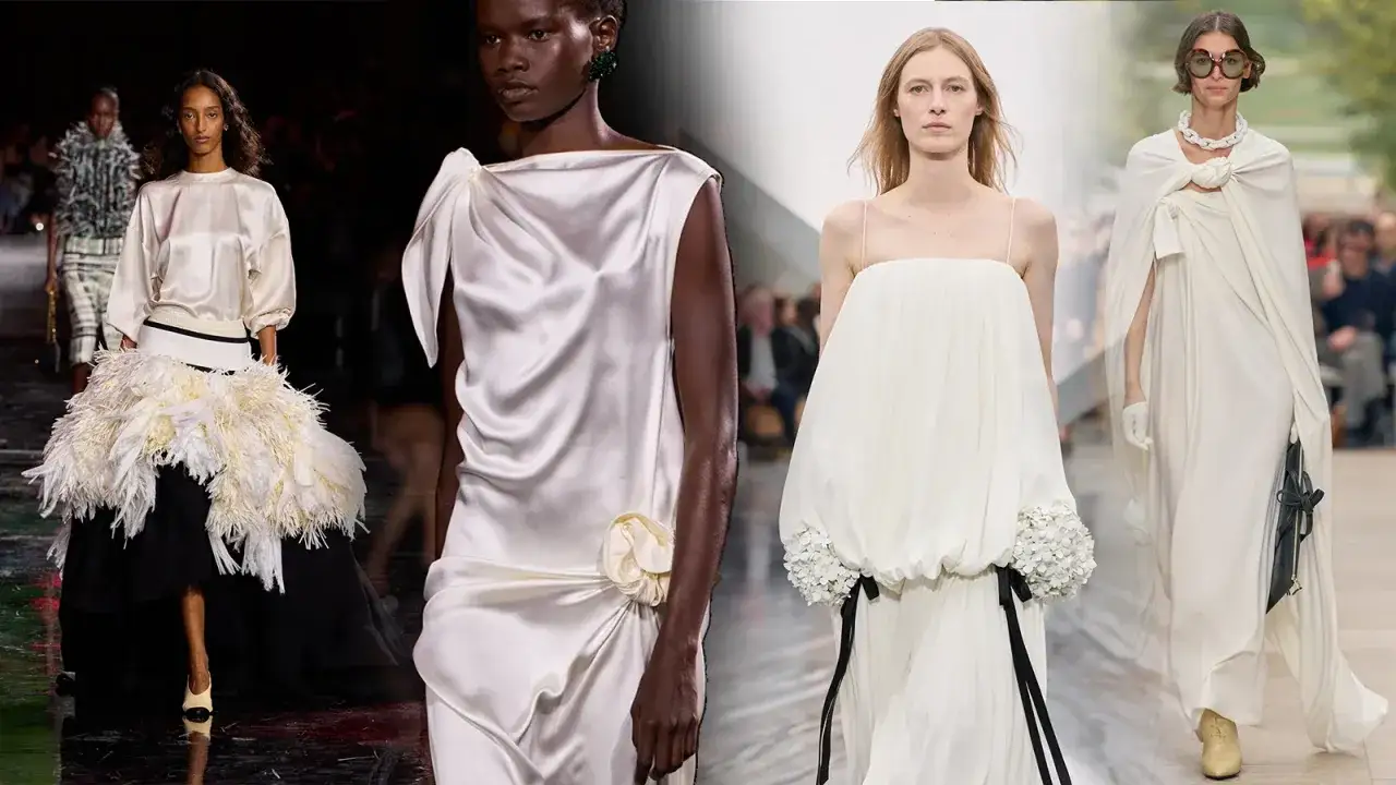 Sfilata di moda con abiti eleganti in tonalit&agrave; **marrone e bianco**. Piume voluminose, drappeggi setosi e dettagli floreali.