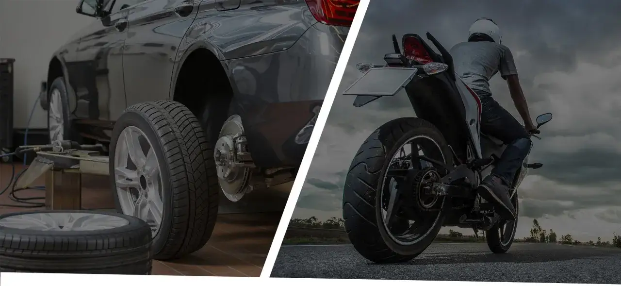 Warsztat samochodowy przygotowuje auto do wymiany opon. Obok motocyklista wyrusza w drogę.