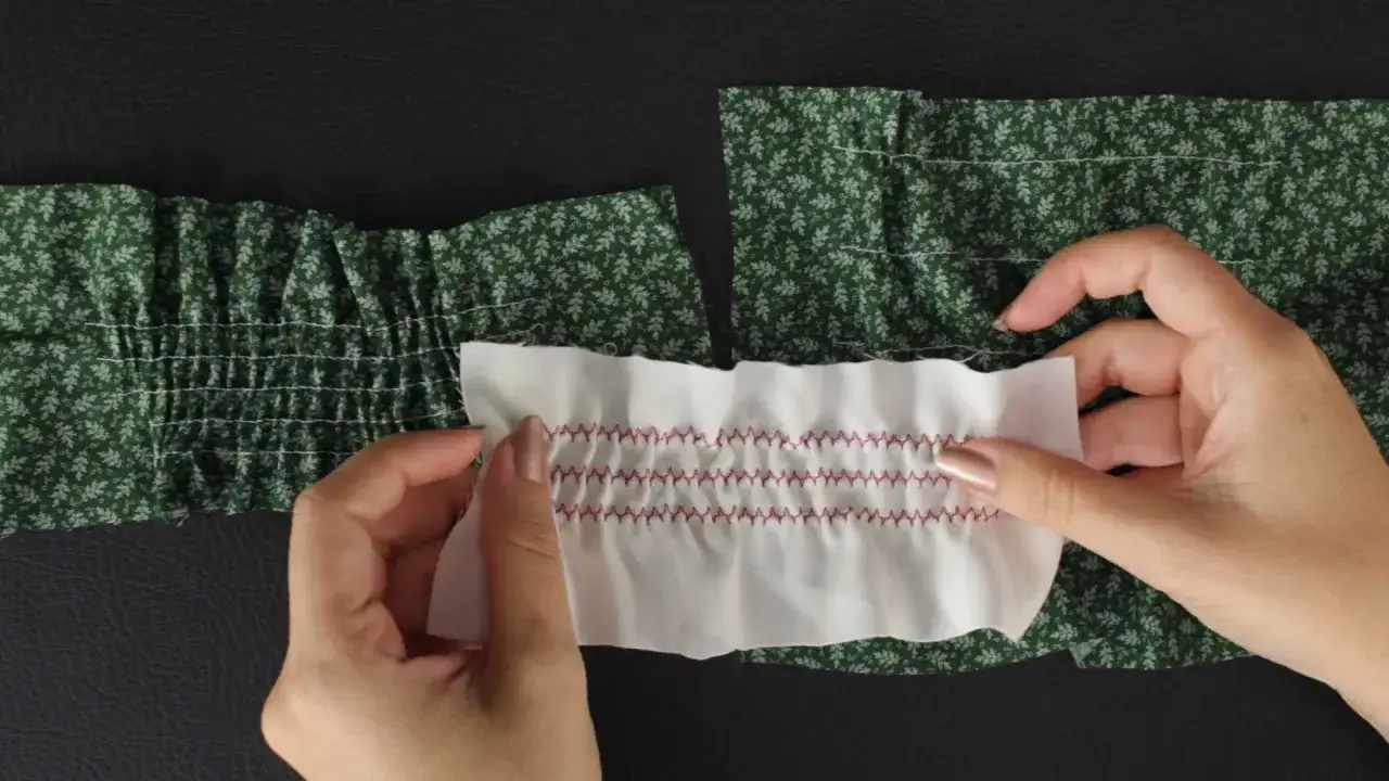 Hands demonstrate how to sew with elastic thread, creating shirring on fabric. One piece shows white elastic stitches on green floral fabric, the other a white fabric with red zig-zag stitches.