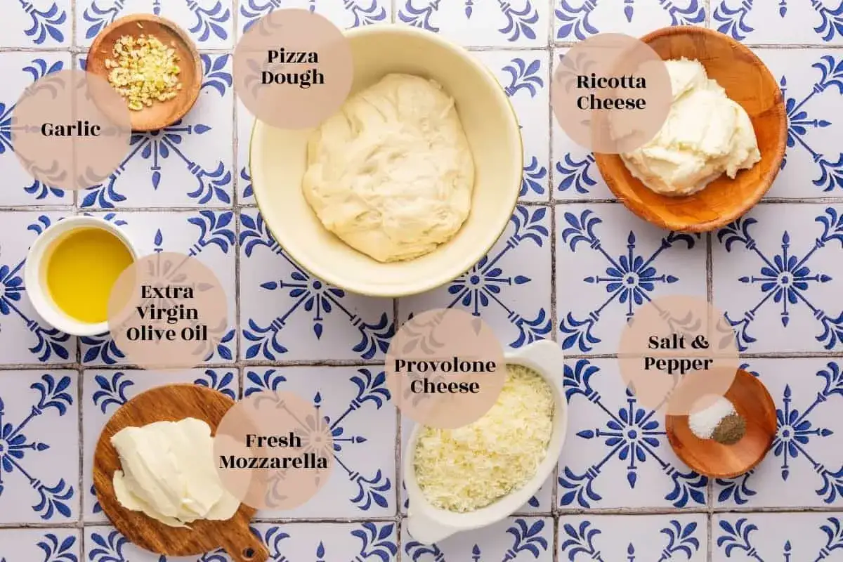Ingr&eacute;dients pour une pizza maison : p&acirc;te, ail, huile d'olive, mozzarella, provolone, sel, poivre et une g&eacute;n&eacute;reuse portion de ricotta.