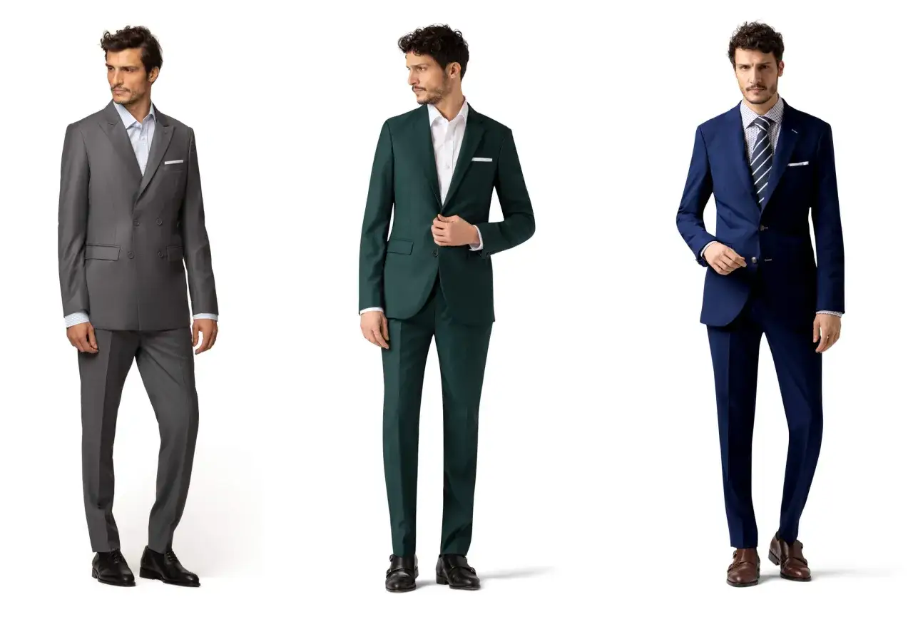 Drei M&auml;nner in eleganten, semi-formellen Anz&uuml;gen: grau, gr&uuml;n und blau.
