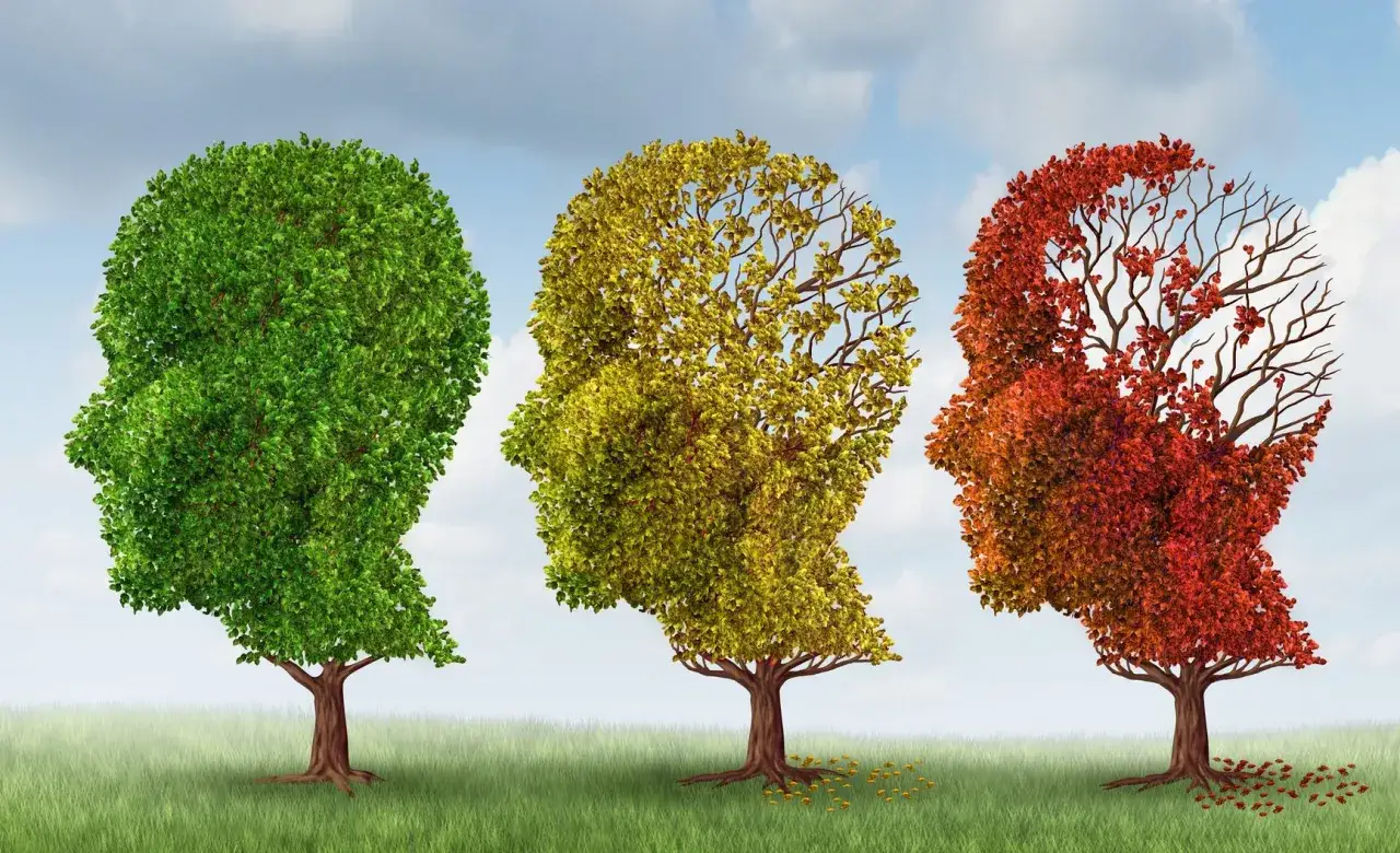 Tre alberi a forma di testa umana, dal verde rigoglioso al rosso spoglio, simboleggiano la poca memoria cosa fare.