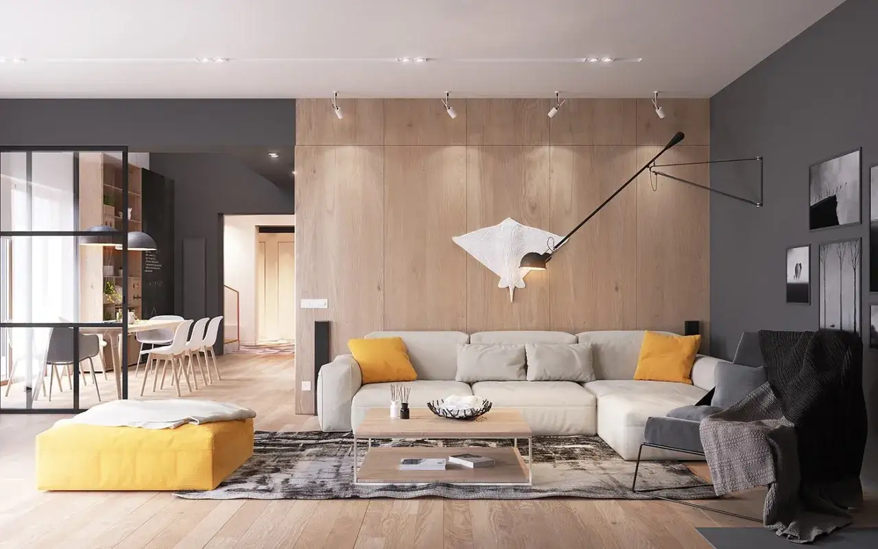 Nowoczesny salon w stylu scandi chic z dużą, beżową kanapą, drewnianą ścianą i żółtym pufem.