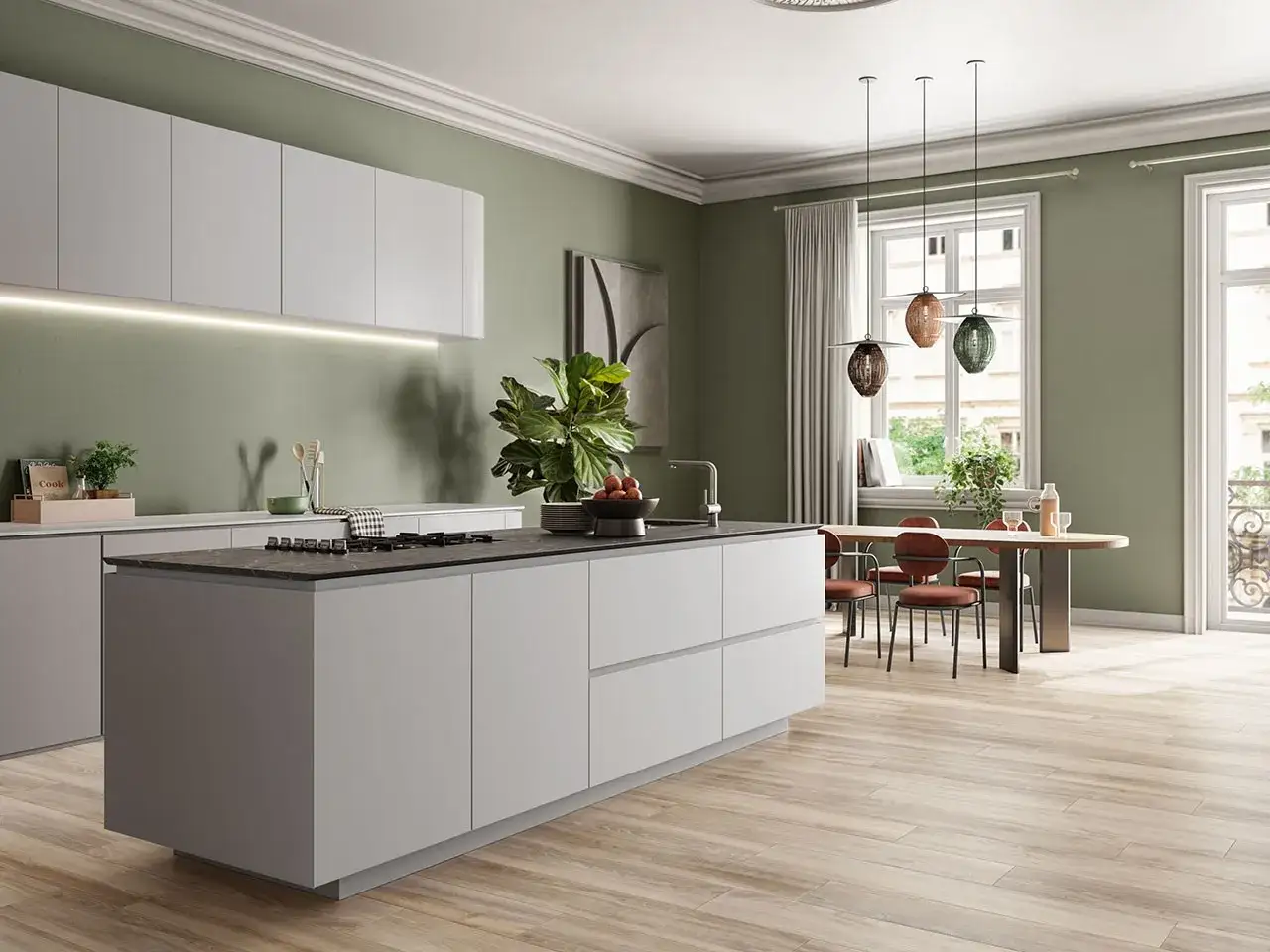 Cucina moderna con isola centrale, mobili grigi e pareti verde salvia. Ottime idee pitture per cucina per un ambiente luminoso e accogliente.