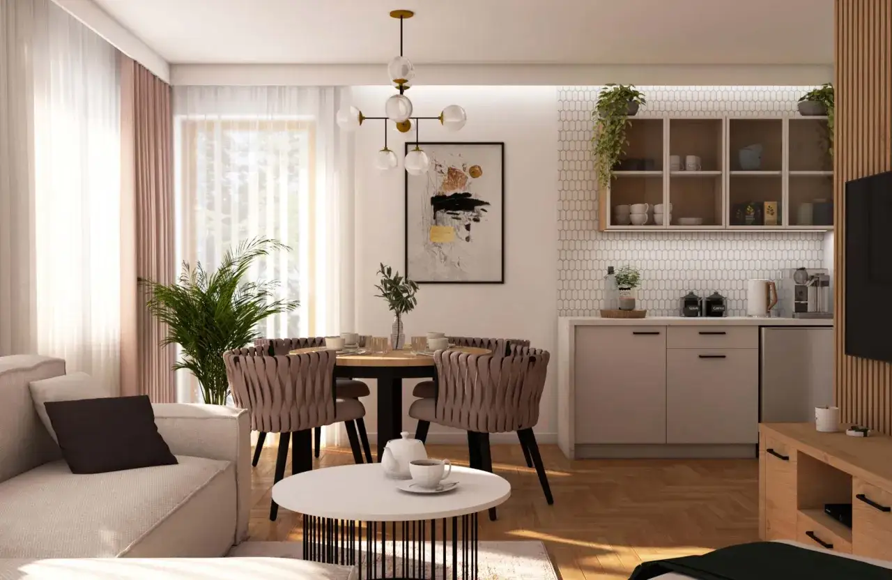 Nowoczesny salon z jadalnią. Jak rozmieścić oświetlenie w salonie? Centralny żyrandol nad stołem, subtelne światło nad blatem kuchennym i lampa podłogowa przy sofie.