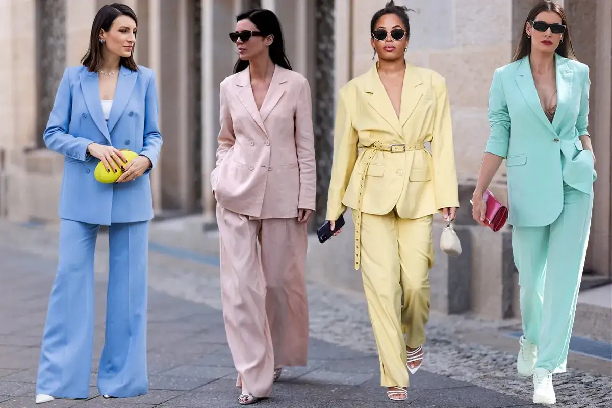 Quattro donne sfoggiano tailleur pastello: azzurro, rosa, giallo e menta. Ispirazione su cosa indossare sopra un tailleur in primavera.