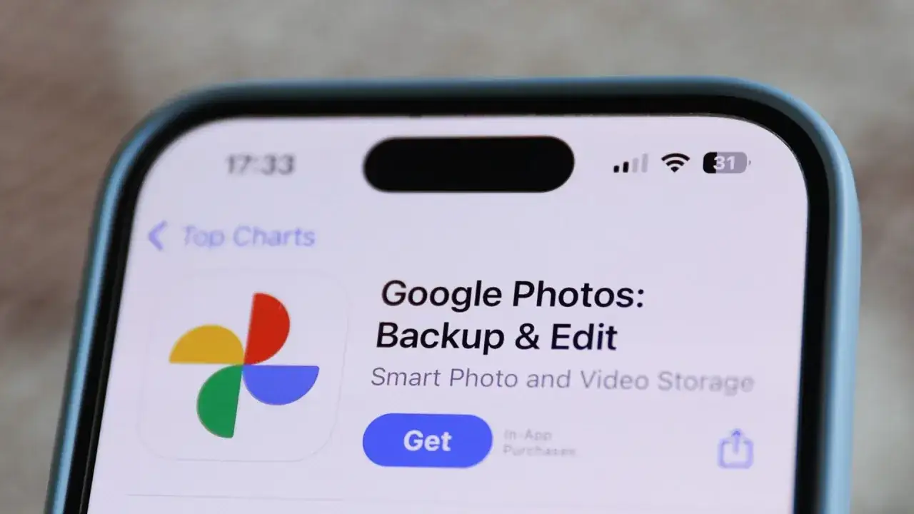 iPhone screen showing the Google Photos app page, ready to download. Learn how to move pictures to Google Photos.