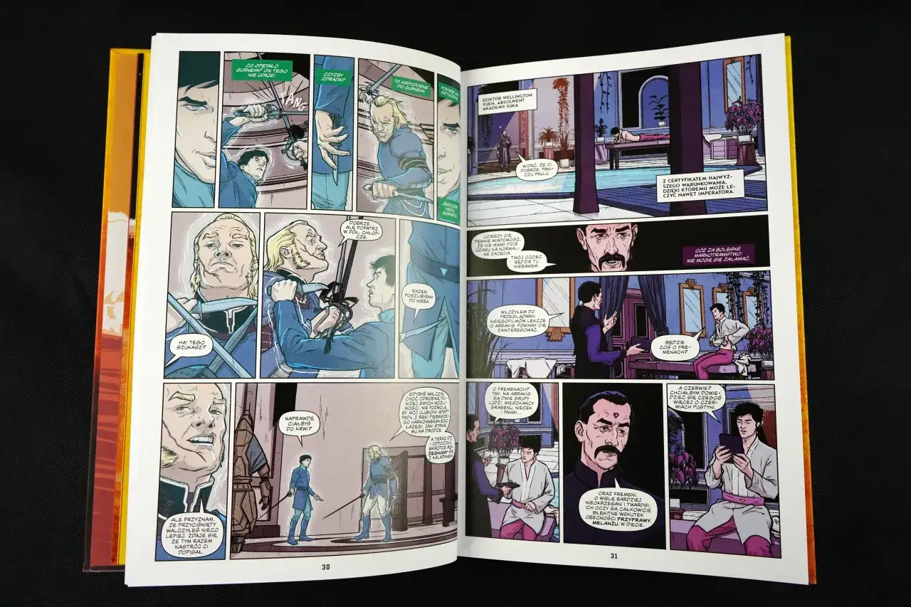 Czy komiks to książka? Na stronach 30 i 31 widać panele z ilustracjami i dialogami, przedstawiające postacie w strojach z epoki, dyskutujące o walce i przyszłości.