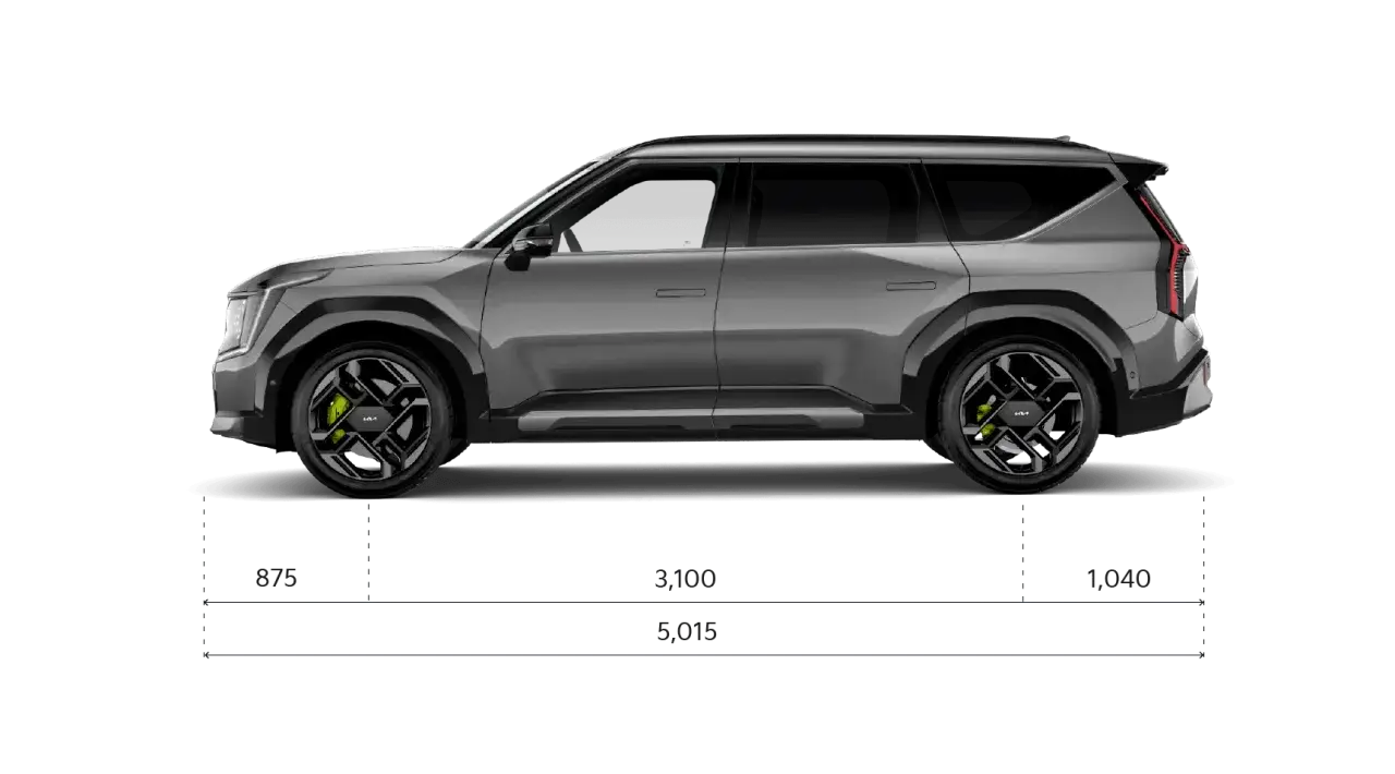 Gr&aring; Kia EV9 i sidovy med m&aring;tt. Bilen har en imponerande kia ev9 vikt, vilket syns p&aring; dess robusta design.