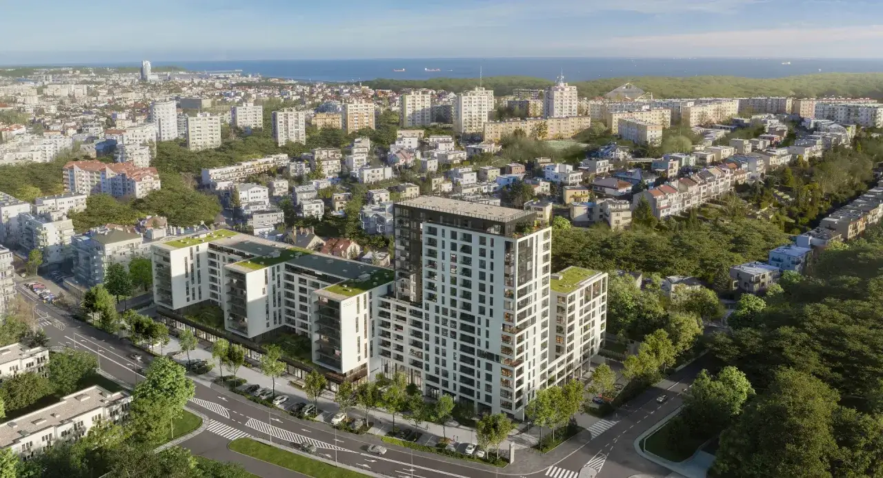 Nowe inwestycje Gdynia: nowoczesne apartamentowce z zielonymi dachami w otoczeniu drzew, z widokiem na morze i miasto.