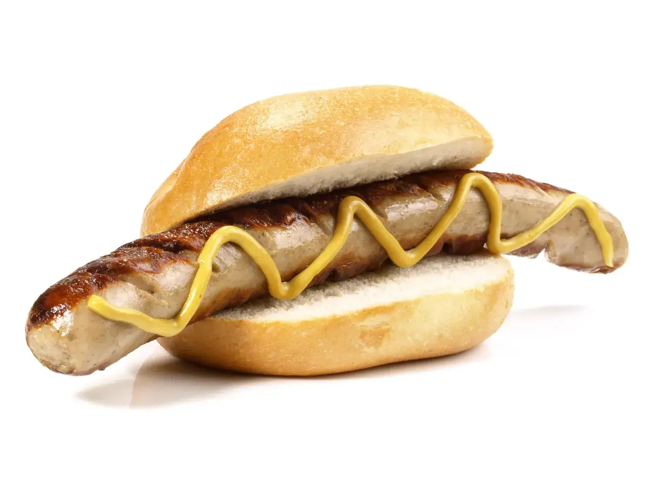 Eine gegrillte Bratwurst mit Senf im Brötchen. Wer sich über die Bratwurst Kalorien informieren möchte, findet hier ein appetitliches Bild.