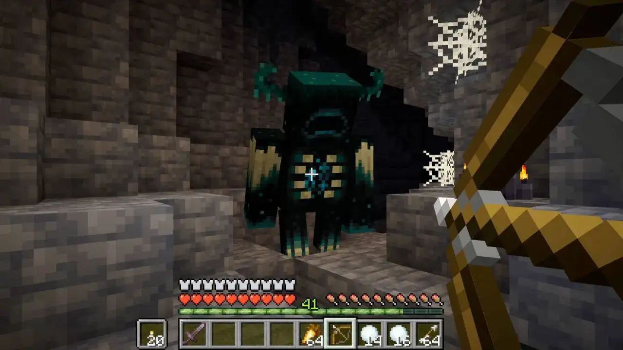 Gracz z łukiem w ręku staje naprzeciwko potężnego Wardena w jaskini, w świecie minecraft 1.17.