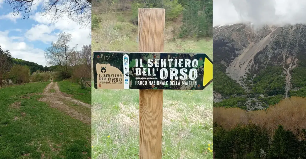 Segnale del sentiero dell'orso nel Parco Nazionale della Maiella, con un percorso sterrato e montagne sullo sfondo.