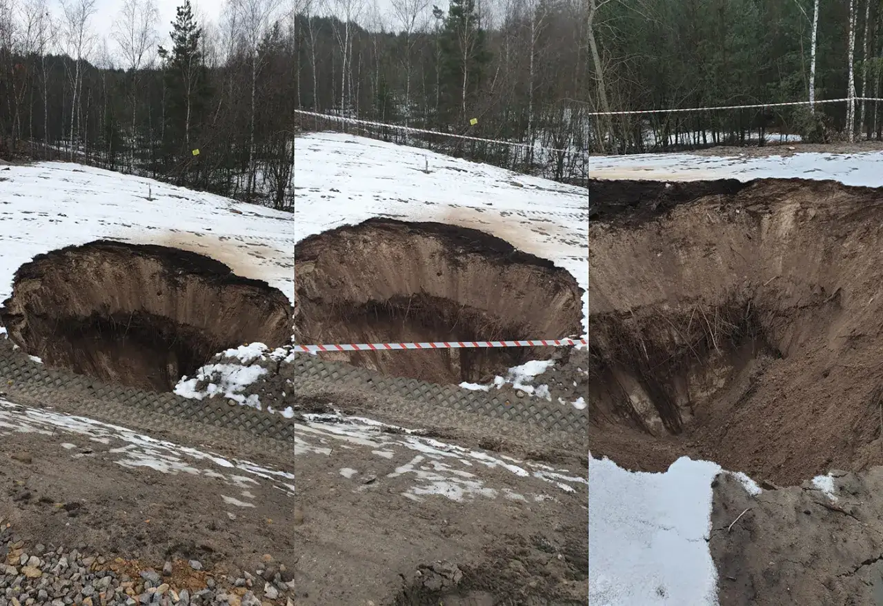 Ogromna dziura w ziemi przy obwodnicy Bolesławia, otoczona taśmą ostrzegawczą. Śnieg i błoto wokół.