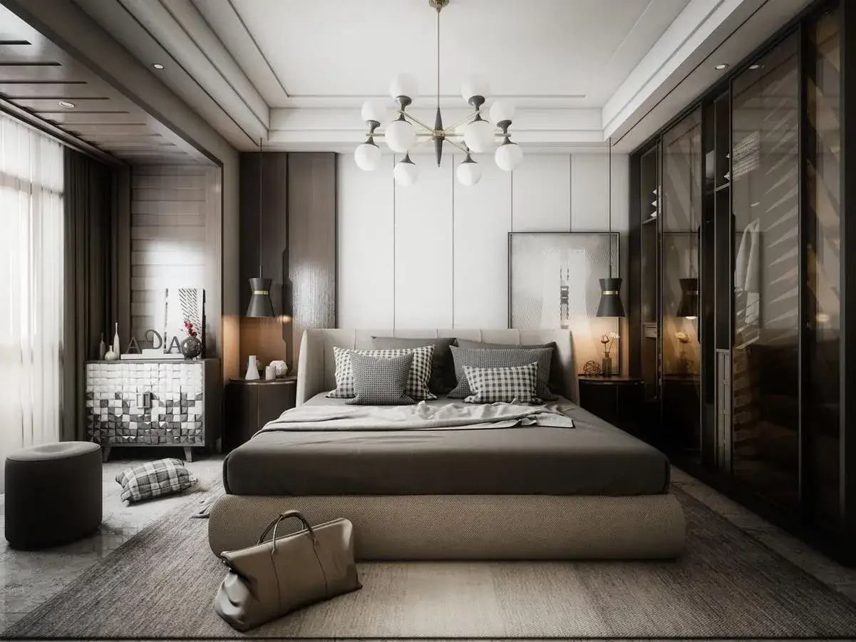 Elegancka sypialnia w stylu hotelowym. Duże ł&oacute;żko z szarą pościelą, designerska szafa, nowoczesna lampa i stylowe dodatki tworzą luksusową atmosferę.