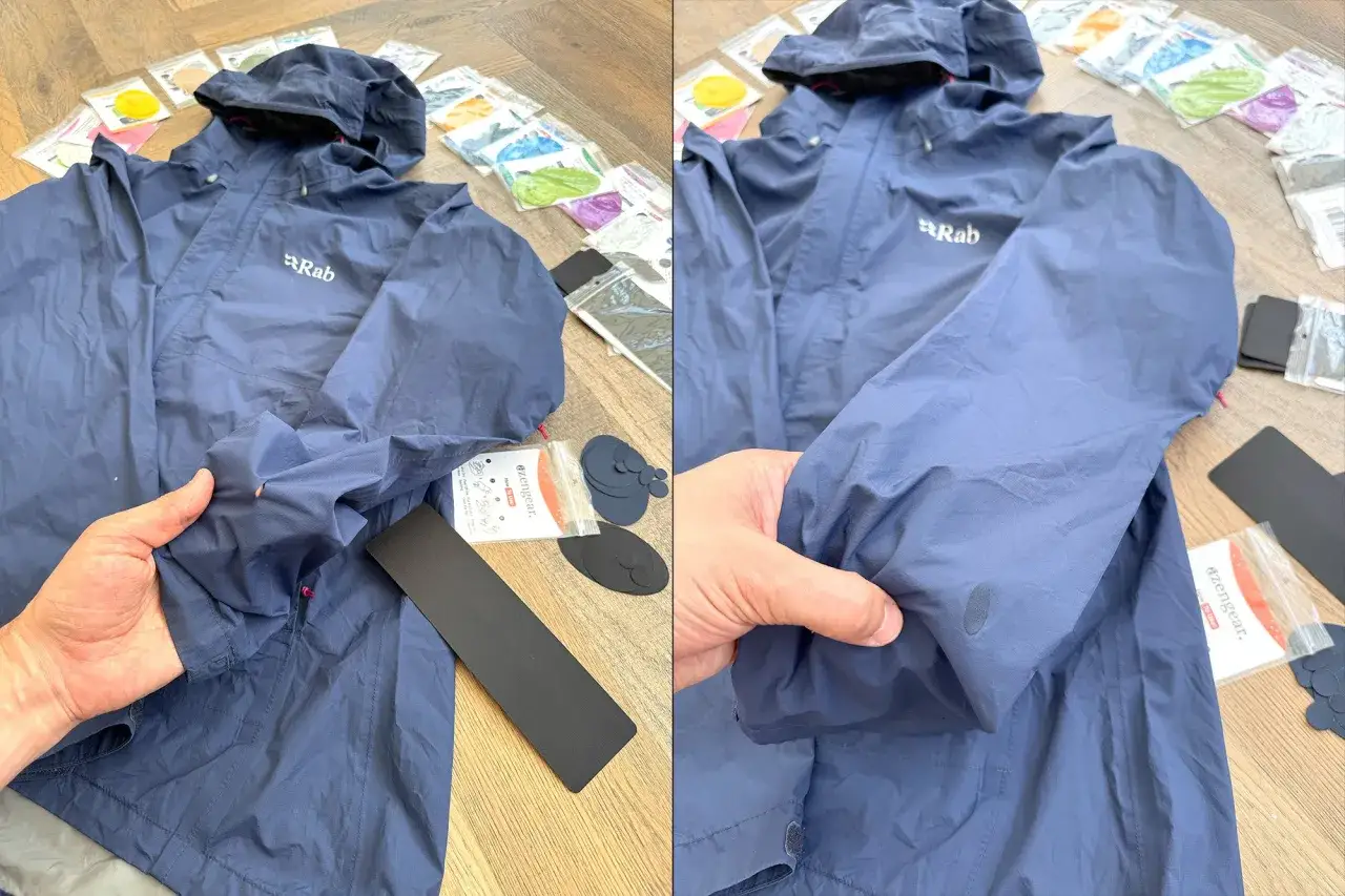 Blaue Rab-Jacke mit kleinem Loch, bereit f&uuml;r die daunenjacke reparieren mit einem Reparaturset.