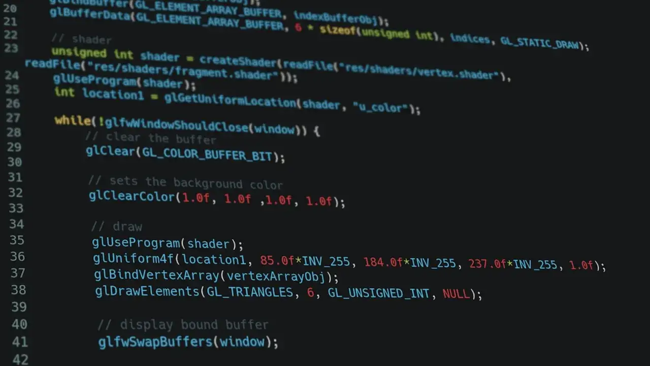 Kod w C++ do rysowania tr&oacute;jkąt&oacute;w z użyciem OpenGL. Widać tu inicjalizację shadera, ustawianie koloru tła i rysowanie geometrii.