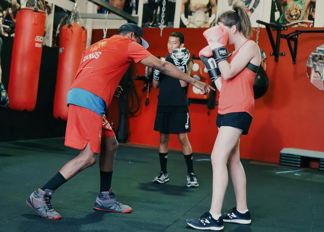 Coach instructs young boxers on footwork, aiming to develop their skills for becoming the best counter punchers in boxing.