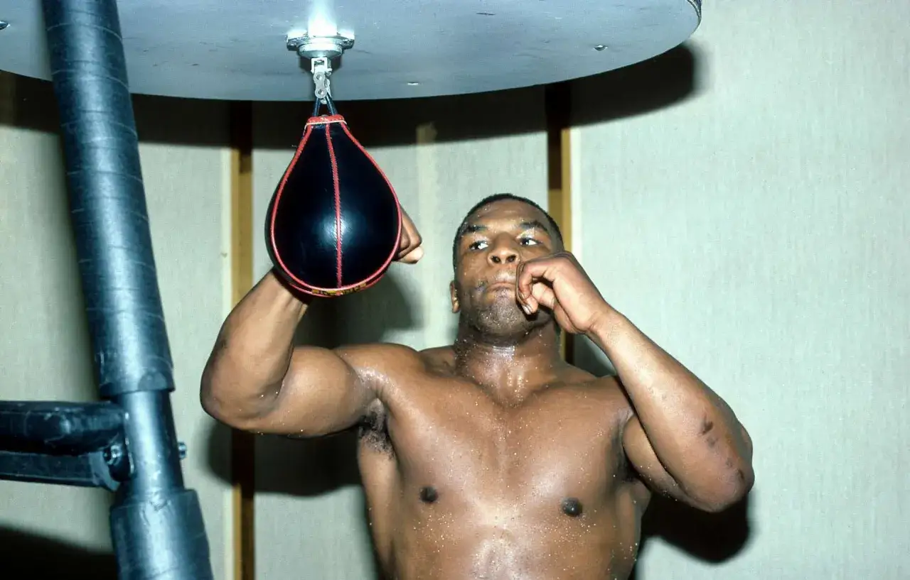 Mike Tyson trains with a speed bag, a common sight where he trained.