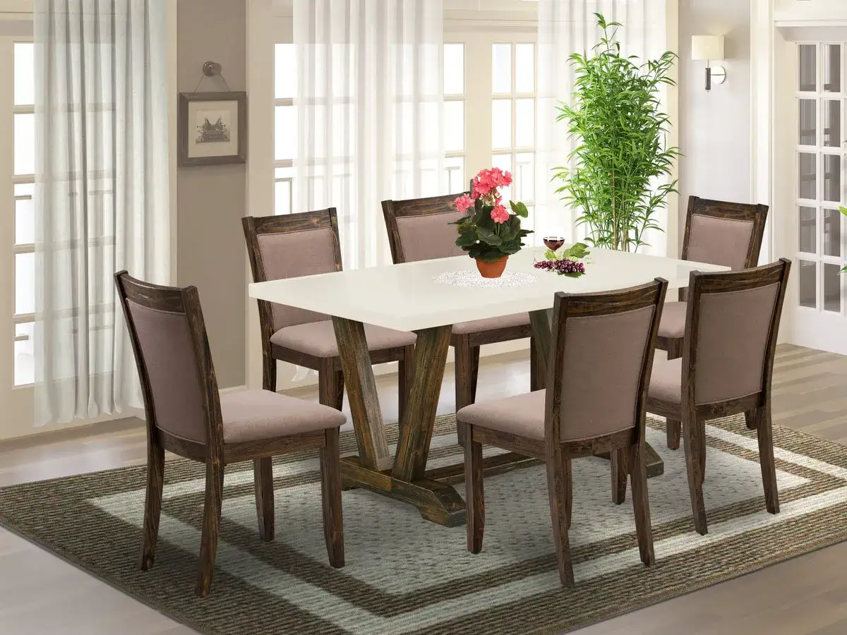 A dining table for 6, with a white top and rustic wood base, surrounded by six upholstered chairs.