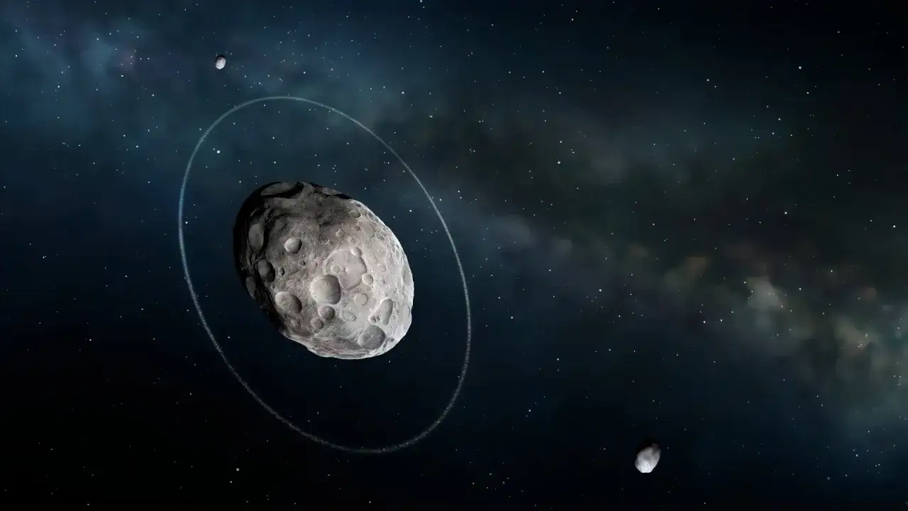 Haumea planeta z pierścieniem i dwoma księżycami na tle gwieździstego nieba.