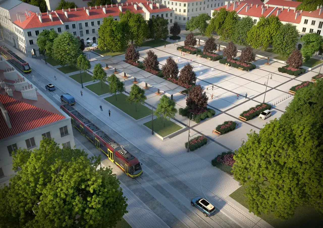 Nowoczesny plac w **Łodzi stare miasto** z tramwajami, samochodami i zielenią.