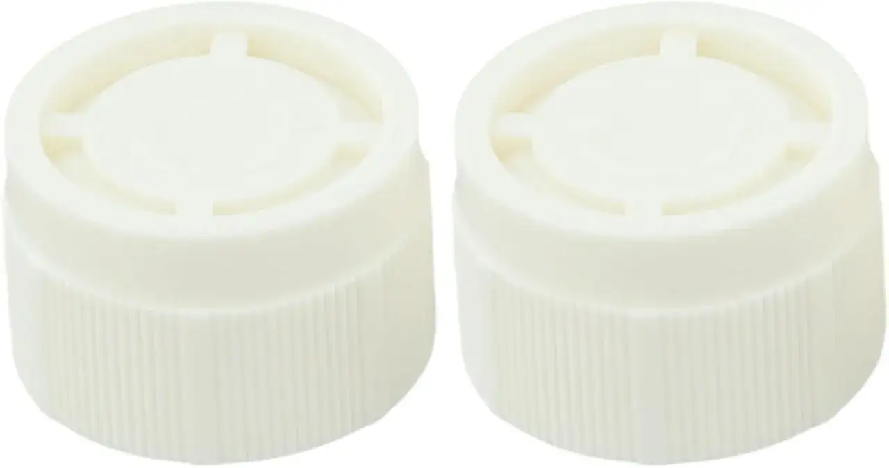 Due manopole bianche per termosifone, con scanalature per presa. Girare in senso orario o antiorario per regolare la temperatura.