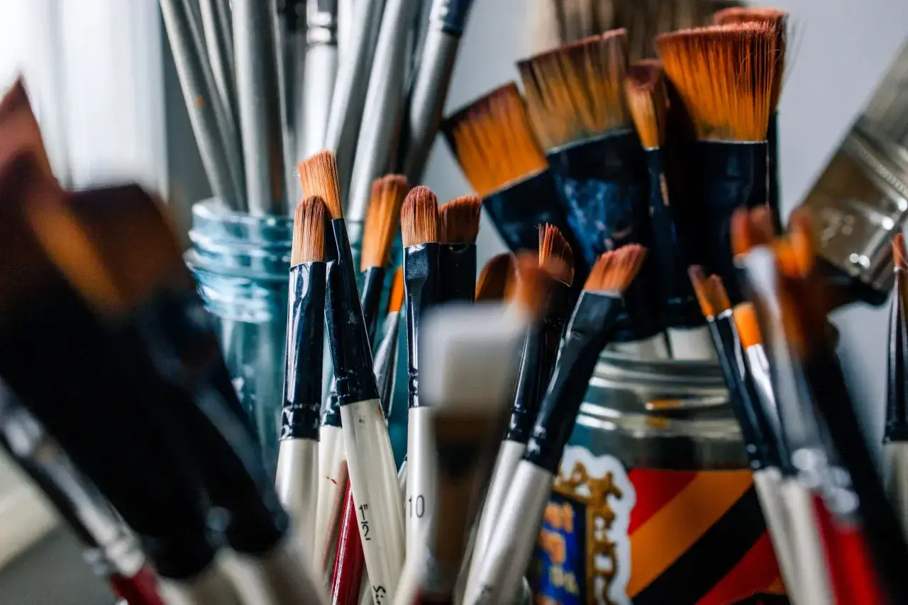 A collection of paintbrushes, ready to create an oil painting.