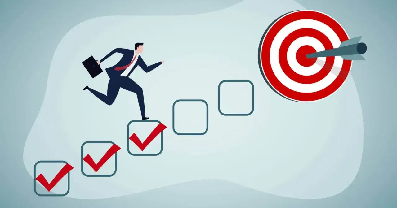 A businessman runs up steps with checkmarks, aiming for a bullseye target. This illustrates how to make money as a graphic designer by achieving goals.