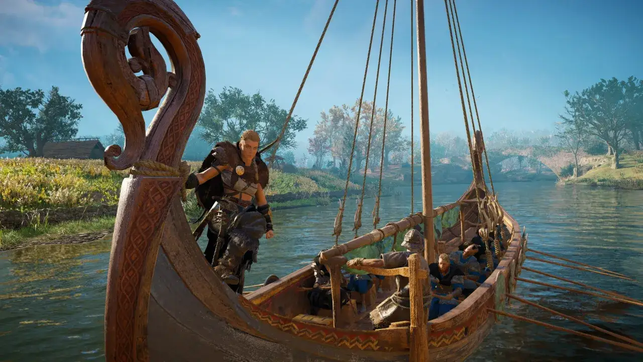 Eivor na łodzi wikingów, gotowa do walki w Assassin's Creed Valhalla. W tle rzeka i most.