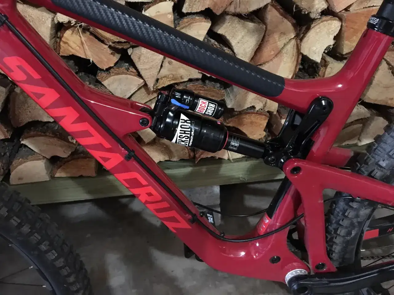 Red Santa Cruz bike with a RockShox Monarch Plus RC3 shock, ready for adventure.