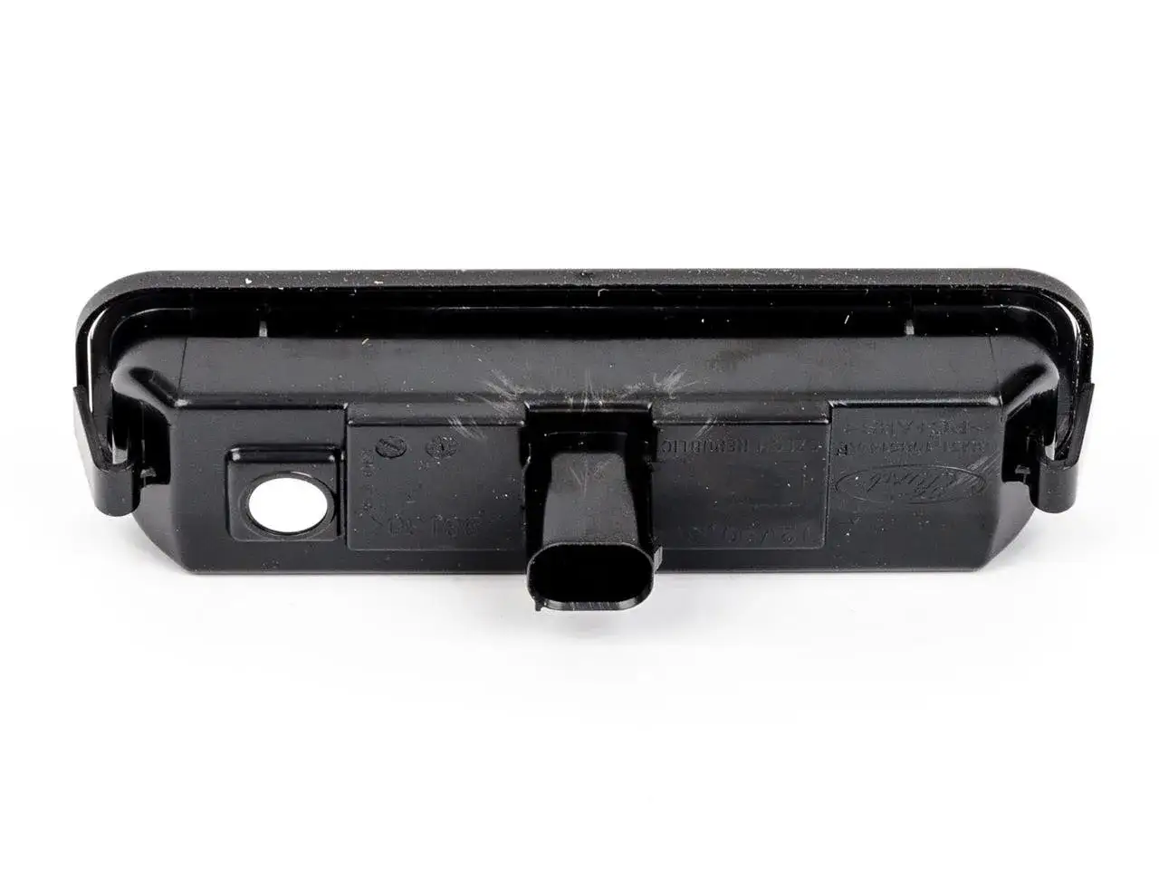 Lampa oświetlenia tablicy rejestracyjnej do Ford Focus MK3. Gotowa do wymiany żarówki, by znów świeciła jasno.